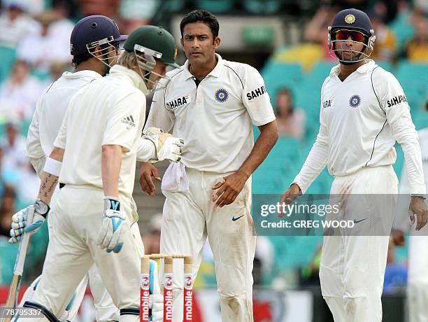 India's captain Anil Kumble looks towards Australian batsman Michael Clarke after taking his wicket on day four of the second Test match at the...