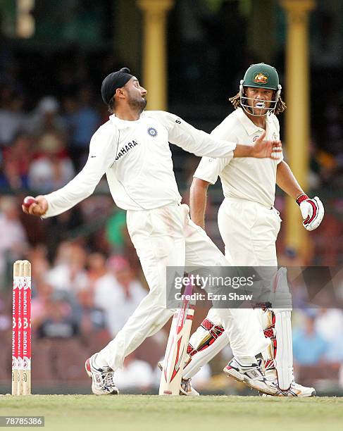 Andrew Symonds of Australia watches Harbhajan Singh of India bowl during day four of the Second Test match between Australia and India at the Sydney...