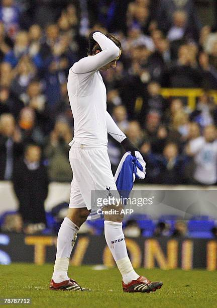 Tottenham Hotspur footballer Dimitar Berbatov walks off the pitch at the end of his team's 3rd round FA Cup match against Reading at White Hart Lane...