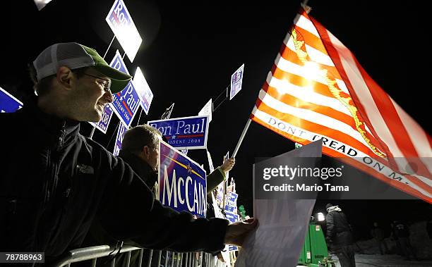 Supporters of Republican presidential hopefuls Sen. John McCain and Rep. Ron Paul look on during a demonstration before back-to-back presidential...