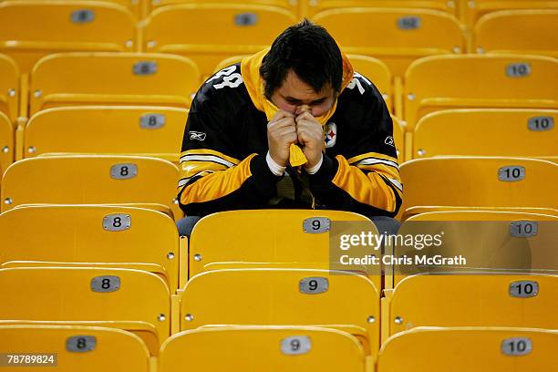 Pittsburgh Steelers fans sits in the stands after the Steelers lost to the Jacksonville Jaguars in the AFC Wild Card game on January 5, 2008 at Heinz...