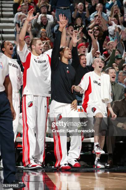 Channing Frye, Joel Przybilla, Brandon Roy and Steve Blake of the Portland Trail Blazers celebrate the last minute during a game against the Utah...