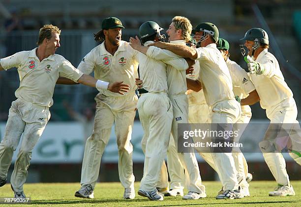 The Australian team celebrate after Michael Clarke took the final wicket for victory during day five of the Second Test match between Australia and...