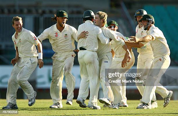 The Australian team celebrate after Michael Clarke took the final wicket for victory during day five of the Second Test match between Australia and...