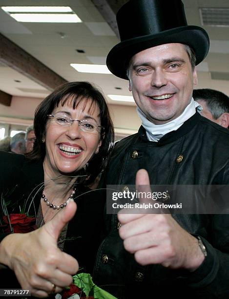 Chimney-sweeper Veit Wilhelmy and Social Democrate Andrea Ypsilanti smile during the new year's reception of the regional Social Democratic Party...