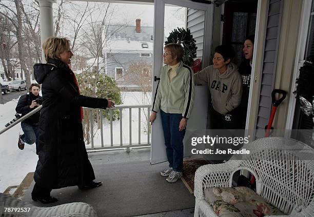 Democratic presidential candidate Sen. Hillary Clinton is greeted by Mary Johnson , Stephanie Larkin and Pam DiNapoli as she visits Mary's home while...