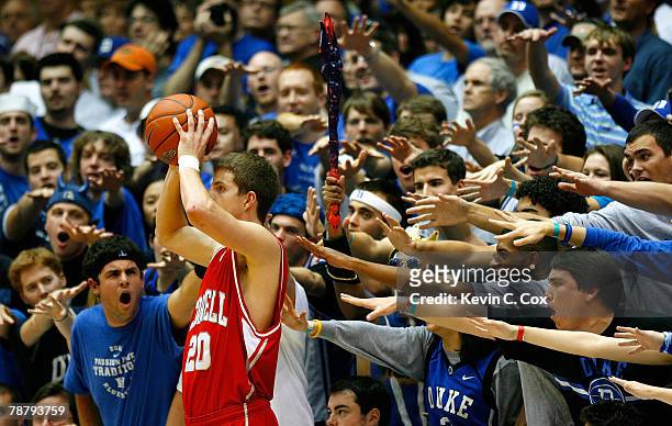 The Cameron Crazies heckle Ryan Wittman of the Cornell Big Red during the game against the Duke Blue Devils at Cameron Indoor Stadium on January 6,...