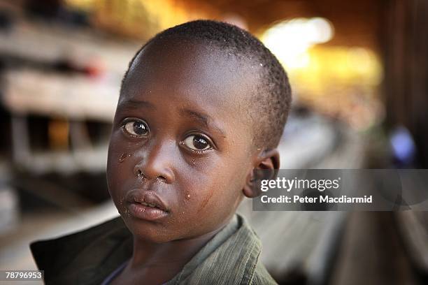 Kikuyu cries with hunger at the Nakuru show ground on January 7, 2008 in Nakuru, Kenya. Local volunteers and charities are helping thousands of...