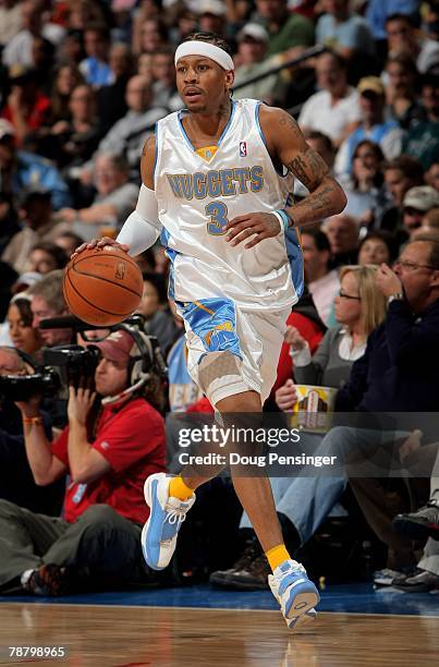 Allen Iverson of the Denver Nuggets dribbles agasint the Philadelphia 76ers as he had a game high 38 points at the Pepsi Center on January 6, 2008 in...