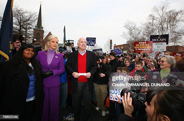 Republican presidential hopeful John McCain , his wife Cindy and their adopted daughter Bridget arrive at a rally in front of the State House in...