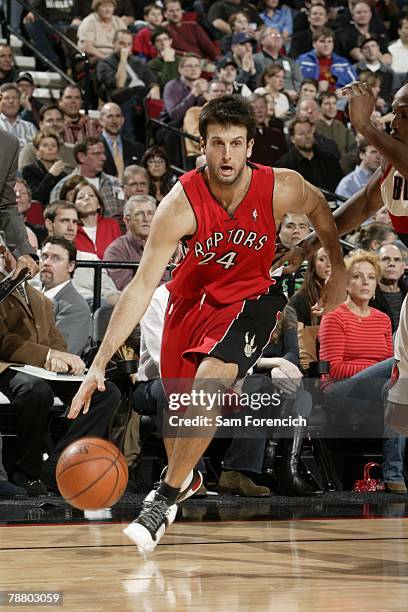 Jason Kapono of the Toronto Raptors moves the ball during the NBA game against the Portland Trail Blazers at the Rose Garden on December 19, 2007 in...