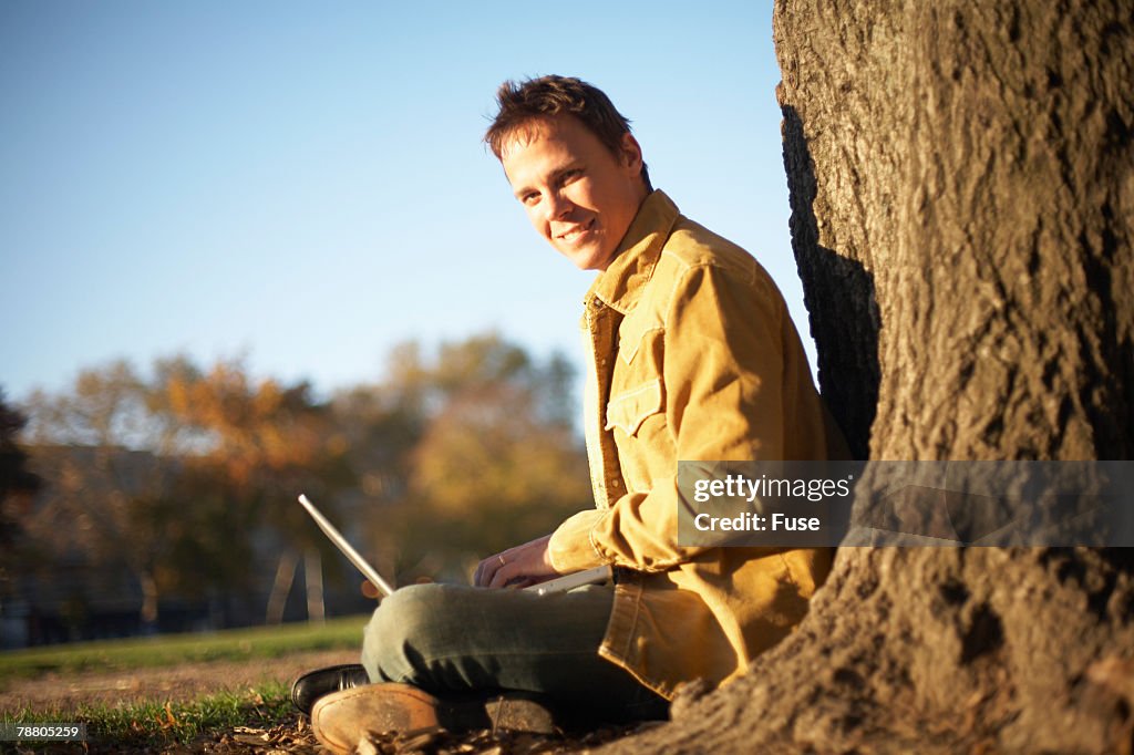 Young Man Using Laptop