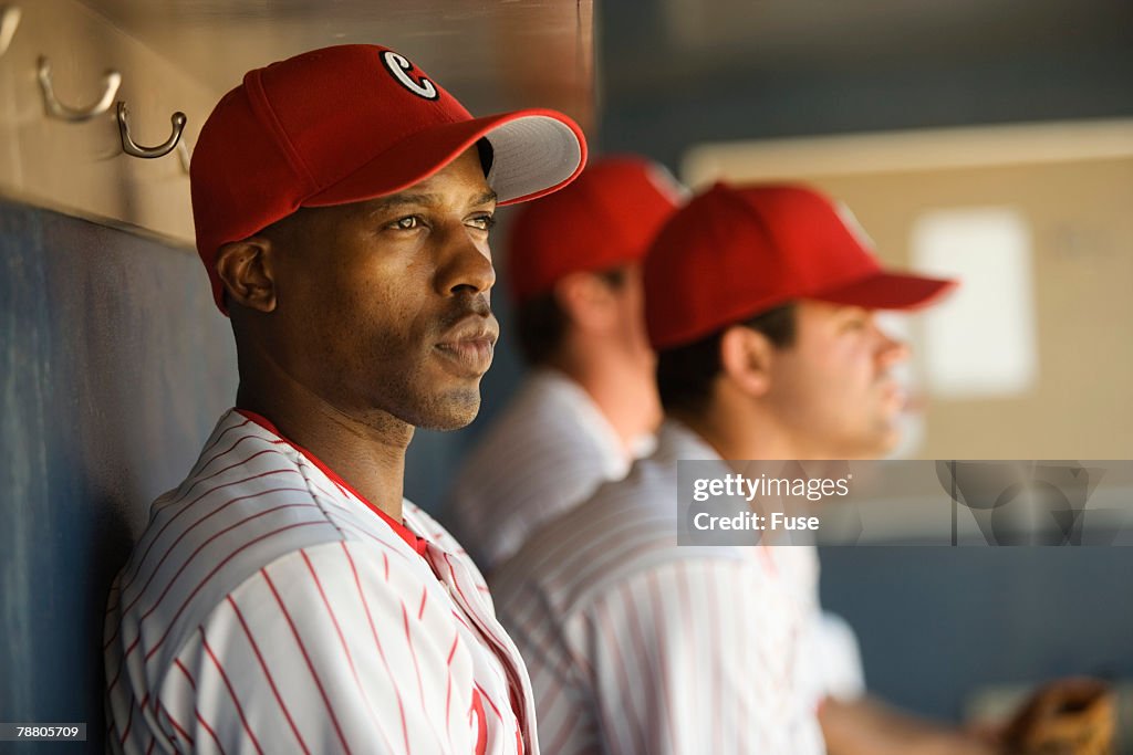 Baseball Players Sitting in the Dugout
