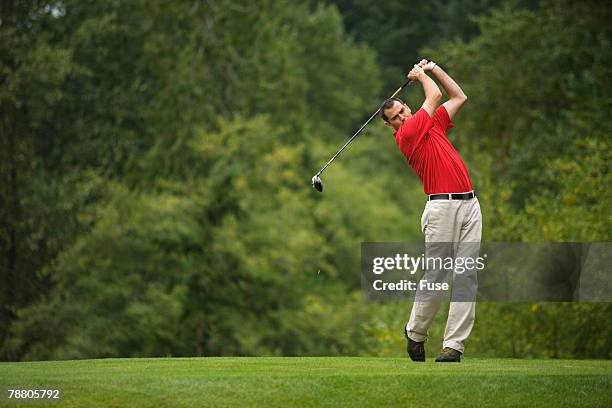 golfer swinging club - man swinging golf club stock pictures, royalty-free photos & images