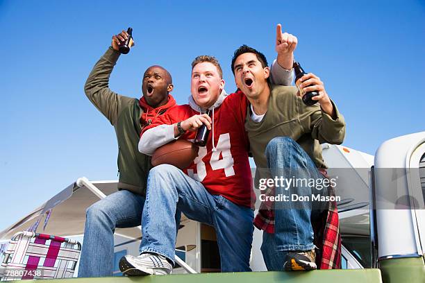 cheering football fans - football tailgate stock pictures, royalty-free photos & images