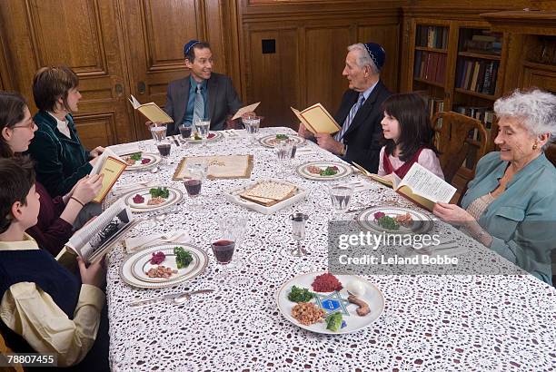 family celebrating passover - pesach seder stock pictures, royalty-free photos & images