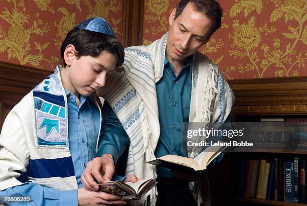 father assisting son with torah - torah dressed stock pictures, royalty-free photos & images