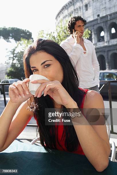 woman enjoying espresso at a sidewalk cafe - roma capucino stock pictures, royalty-free photos & images