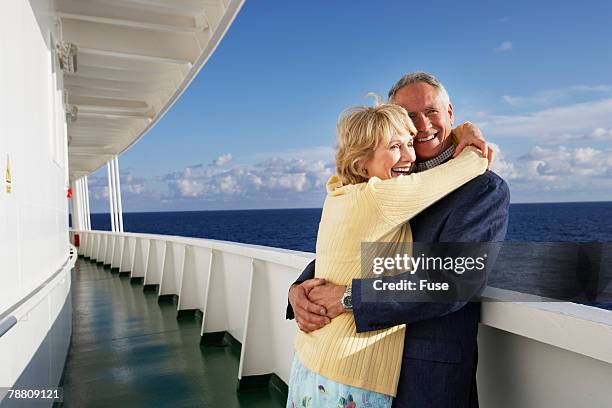 couple on cruise ship hugging - nave passeggeri foto e immagini stock