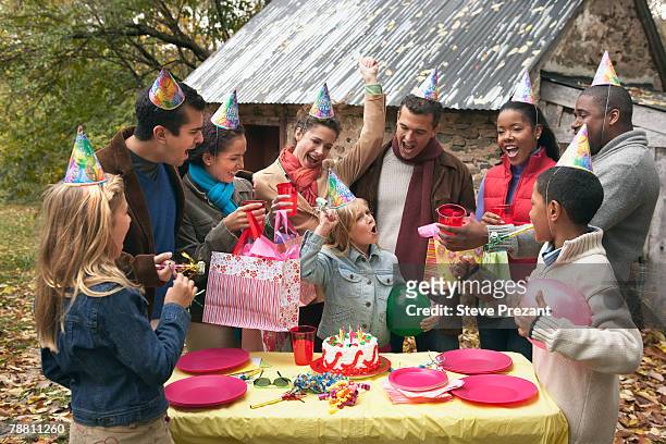 guests at outdoor birthday party - steve prezant stock pictures, royalty-free photos & images