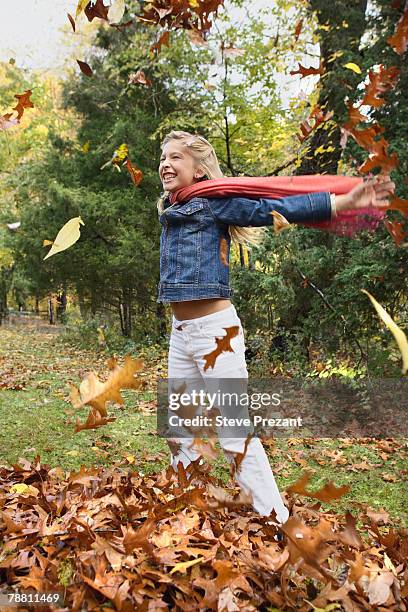 child playing in leaves - steve prezant stock pictures, royalty-free photos & images