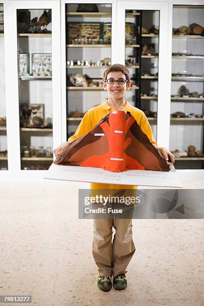 boy holding science fair volcano - science fair volcano stock pictures, royalty-free photos & images