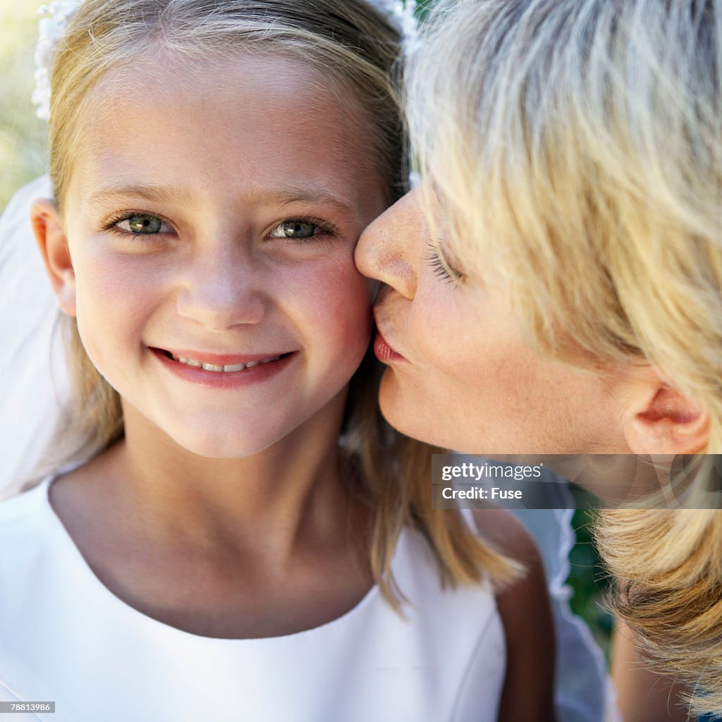 Mother Kissing Daughter