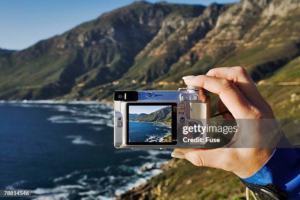 tourist using digital camera at coast - chapmans peak stock pictures, royalty-free photos & images