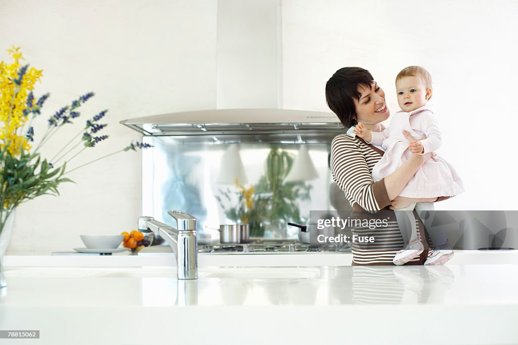 Mother and Baby Girl in Kitchen