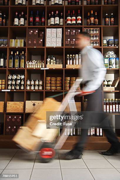 porter in wine shop - porter stock pictures, royalty-free photos & images