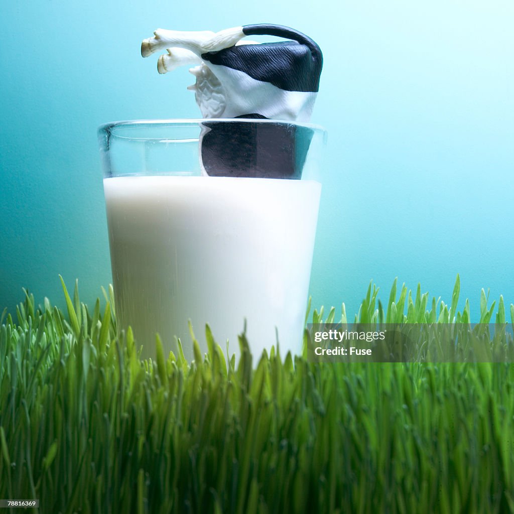 Toy Cow in a Glass of Milk