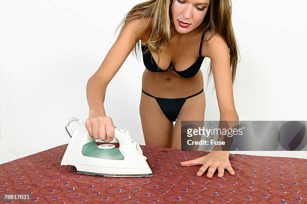 woman ironing - breast ironing bildbanksfoton och bilder