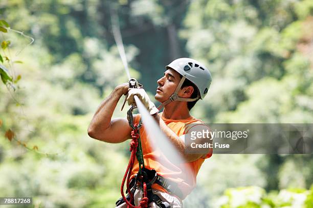 man rappelling - ascender stock pictures, royalty-free photos & images