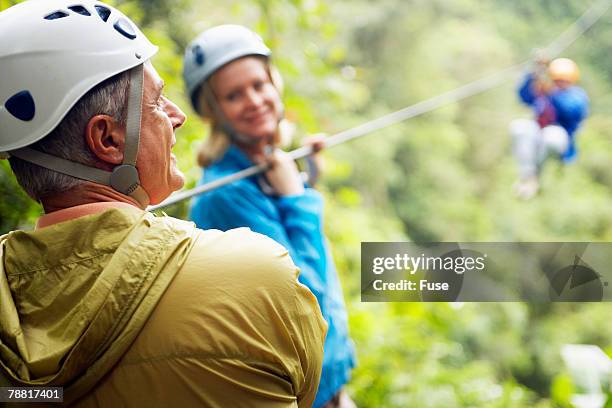 group of people rappelling - extreme depth of field stock pictures, royalty-free photos & images