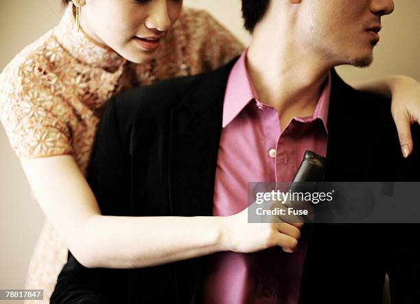 woman taking mans wallet - stereotypically upper class stock pictures, royalty-free photos & images