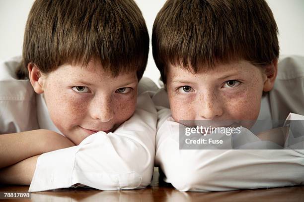 identical twin high school students in class - double facepalm stock pictures, royalty-free photos & images
