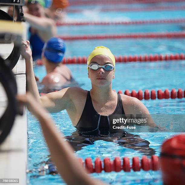 swimmer in pool - swim meet stock pictures, royalty-free photos & images