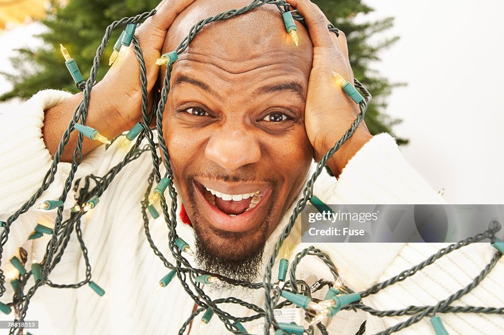 Man Tangled in Christmas Lights