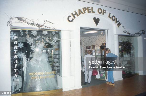Shoppers visit "Chapel of Love" June 1999, where they can buy dresses, tuxedos, rings, and invitations for their wedding in the Mall of America, the...