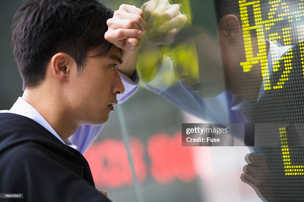 Businessman Looking at Stock Prices