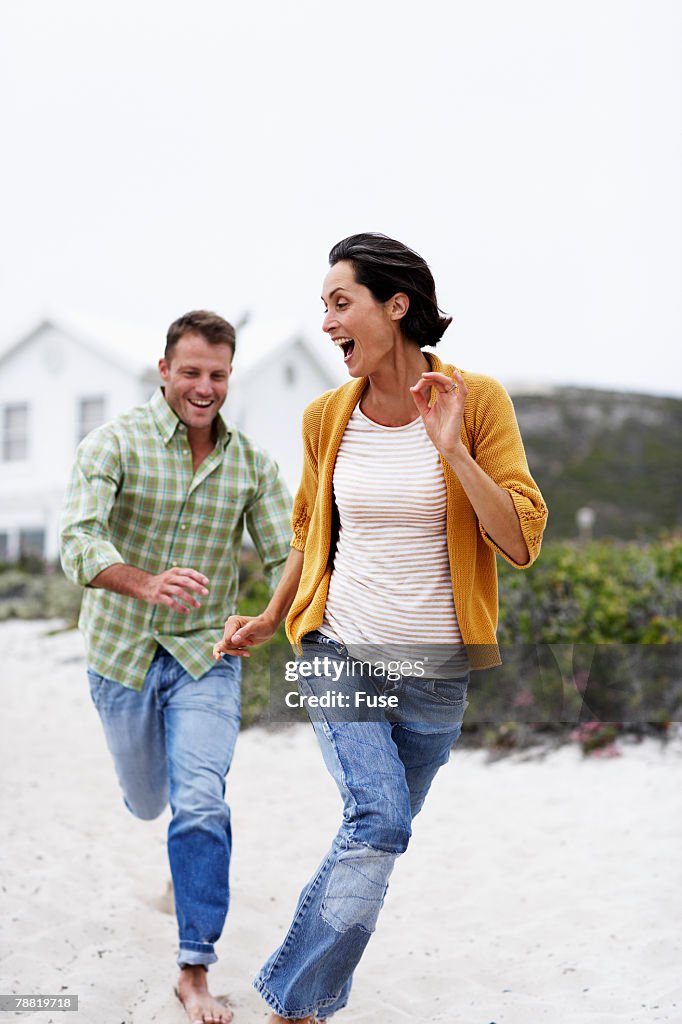 Couple Running on Beach