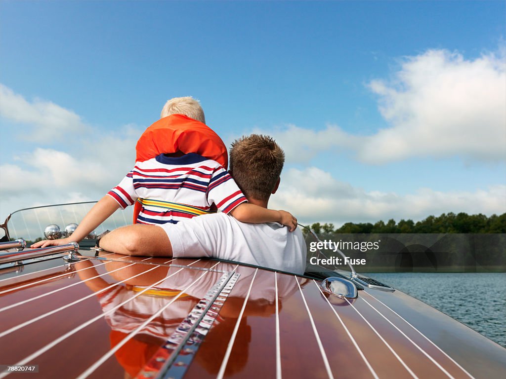 Father and Son in an Old Speed Boat