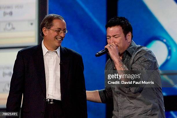 Paul Otellini, Intel president and CEO watches as Steve Harwell, lead singer of the band Smash Mouth, sings during a keynote address at the 2008...