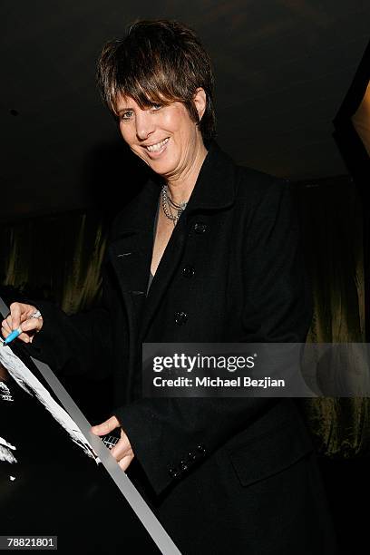 Recording Artist Diane Warren signs movie poster for charity at the Critics' Choice Awards at the Santa Monica Civic Center on January 7, 2008 in...