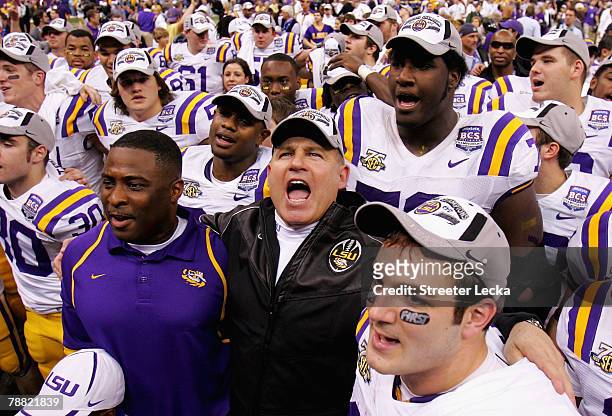 Head coach Les Miles of the Louisiana State University Tigers celebrates with his team after defeating the Ohio State Buckeyes 38-24 in the AllState...