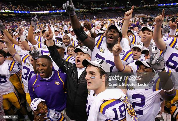 Head coach Les Miles of the Louisiana State University Tigers celebrates with his team after defeating the Ohio State Buckeyes 38-24 in the AllState...