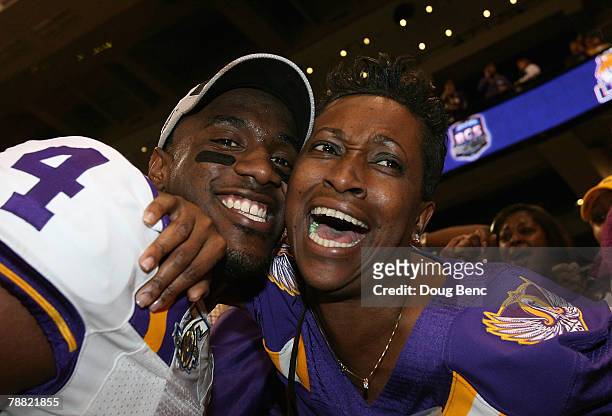 Jai Eugene of the Louisiana State University Tigers hugs his mom Sherry Eugene after defeating the Ohio State Buckeyes 38-24 in the AllState BCS...