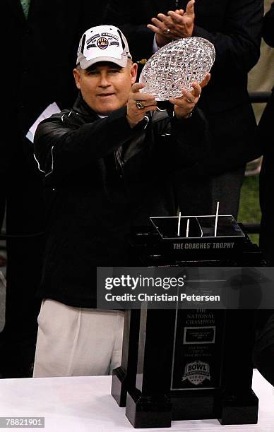 Head coach Les Miles of the Louisiana State University Tigers celebrates with the championship trophy after defeating the Ohio State Buckeyes 38-24...