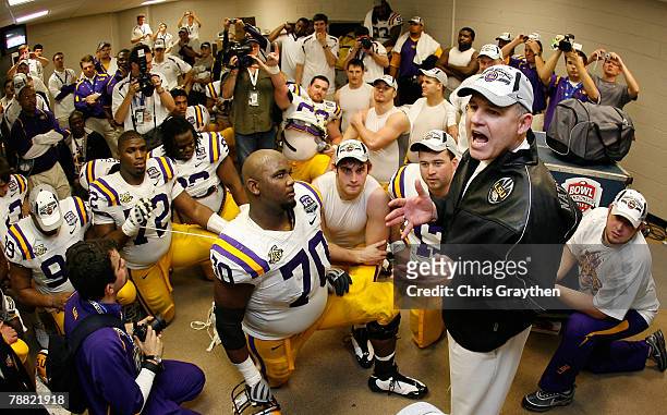 Head coach Les Miles of the Louisiana State University Tigers celebrates with his team in the lockerroom after defeating the Ohio State Buckeyes...