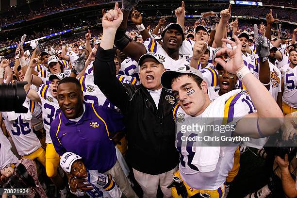 Head coach Les Miles of the Louisiana State University Tigers celebrates with Jacob Hester after defeating the Ohio State Buckeyes 38-24 in the...